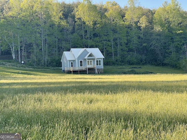 5.765AC Brannon Nix Rd, Blairsville, GA 30512 - view of front of house with a wooden deck and a wooded view