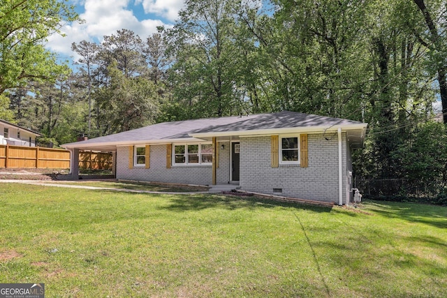 single story home featuring a front lawn, an attached carport, fence, brick siding, and crawl space