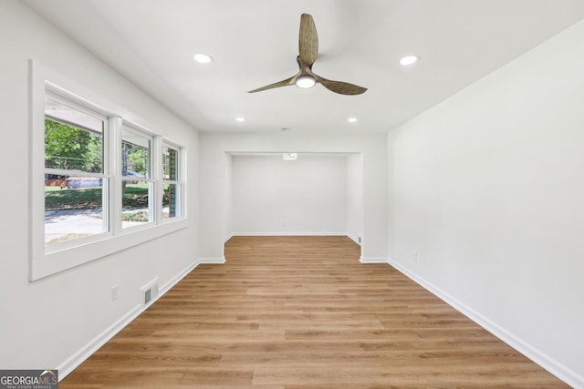 empty room with a ceiling fan, light wood-style flooring, visible vents, and recessed lighting