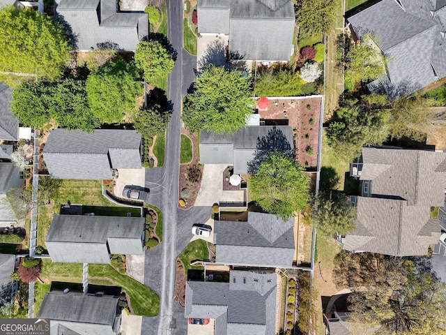 birds eye view of property with a residential view