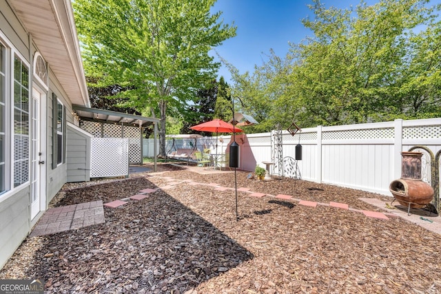 view of yard with a patio and a fenced backyard
