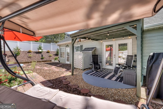 view of patio / terrace featuring a fenced backyard and french doors