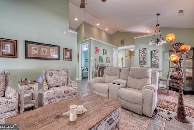 living area featuring light wood-type flooring, ceiling fan, baseboards, visible vents, and recessed lighting
