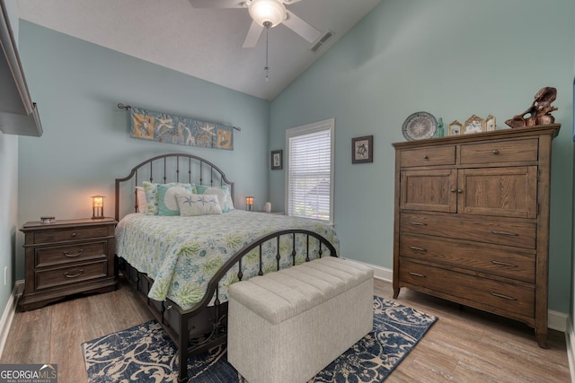 bedroom featuring baseboards, visible vents, and light wood-style flooring