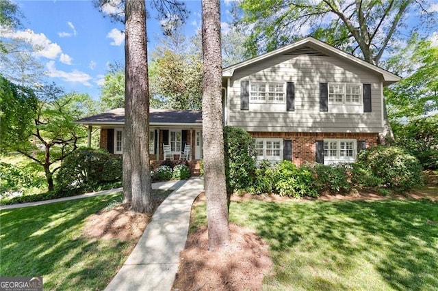 4044 Ashentree Dr, Brookhaven, GA 30341 - tri-level home featuring brick siding and a front lawn