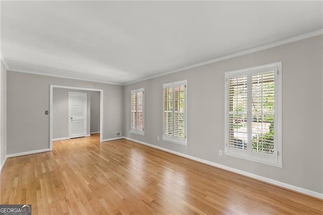 4044 Ashentree Dr, Brookhaven, GA 30341 - unfurnished room with baseboards, ornamental molding, and light wood-style flooring