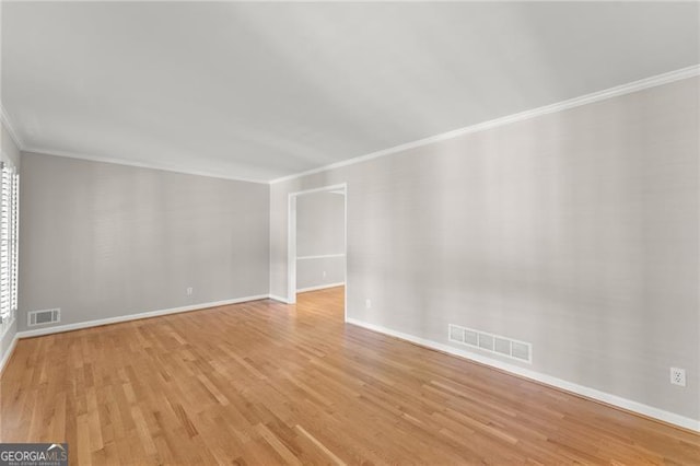 4044 Ashentree Dr, Brookhaven, GA 30341 - unfurnished living room featuring baseboards, wood finished floors, visible vents, and crown molding