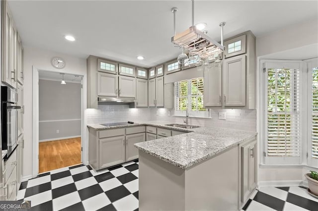 4044 Ashentree Dr, Brookhaven, GA 30341 - kitchen featuring tile patterned floors, a sink, decorative backsplash, a peninsula, and wall oven
