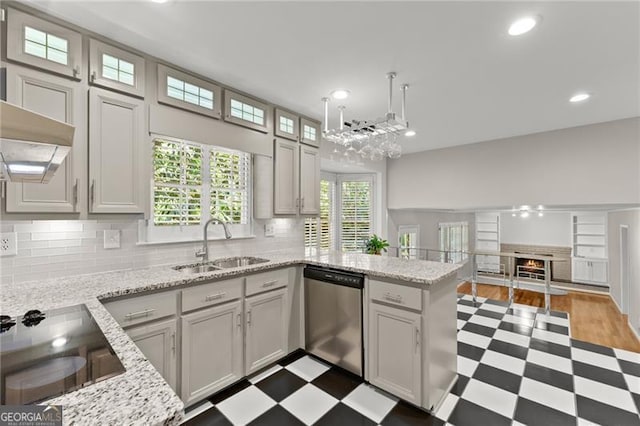 4044 Ashentree Dr, Brookhaven, GA 30341 - kitchen with tile patterned floors, stainless steel dishwasher, a peninsula, a sink, and black electric stovetop