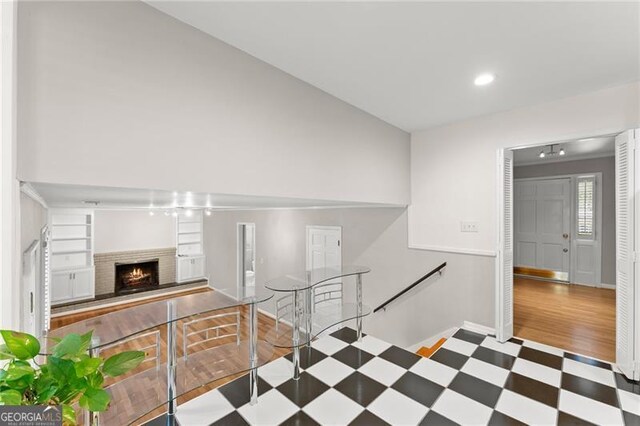 4044 Ashentree Dr, Brookhaven, GA 30341 - interior space featuring a fireplace, baseboards, tile patterned floors, and recessed lighting
