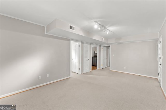 4044 Ashentree Dr, Brookhaven, GA 30341 - unfurnished bedroom featuring track lighting, baseboards, visible vents, and carpet