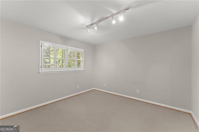 4044 Ashentree Dr, Brookhaven, GA 30341 - carpeted spare room featuring track lighting and baseboards