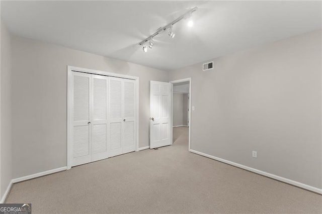 4044 Ashentree Dr, Brookhaven, GA 30341 - unfurnished bedroom featuring baseboards, visible vents, carpet floors, and a closet