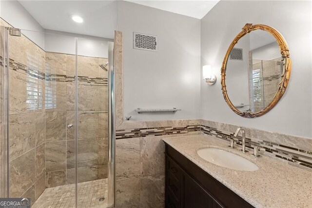 4044 Ashentree Dr, Brookhaven, GA 30341 - bathroom with a shower stall, vanity, visible vents, and recessed lighting