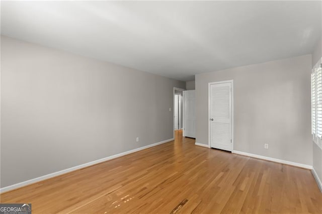 4044 Ashentree Dr, Brookhaven, GA 30341 - unfurnished bedroom featuring baseboards, light wood finished floors, and a closet
