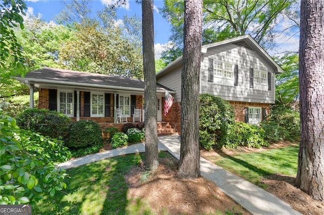 4044 Ashentree Dr, Brookhaven, GA 30341 - split level home with a porch and brick siding