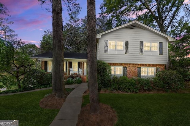 4044 Ashentree Dr, Brookhaven, GA 30341 - split level home featuring brick siding and a lawn