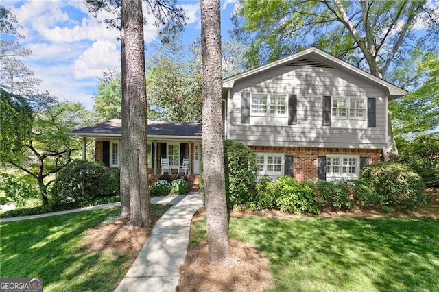 4044 Ashentree Dr, Brookhaven, GA 30341 - split level home with a front lawn and brick siding