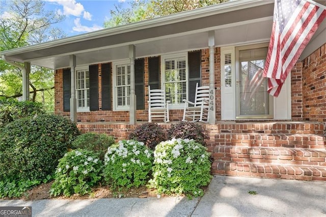 4044 Ashentree Dr, Brookhaven, GA 30341 - entrance to property featuring a porch and brick siding