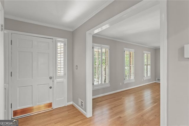 4044 Ashentree Dr, Brookhaven, GA 30341 - foyer featuring light wood-type flooring, baseboards, ornamental molding, and visible vents