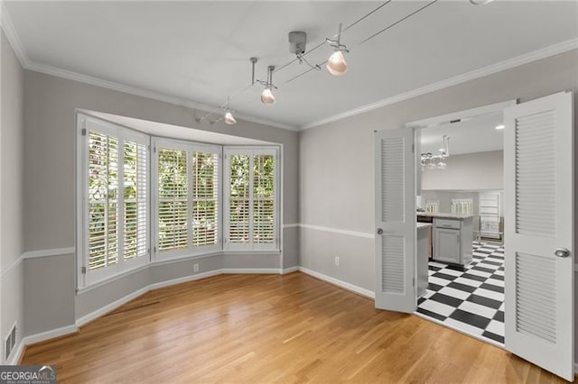 4044 Ashentree Dr, Brookhaven, GA 30341 - interior space featuring crown molding, a chandelier, light floors, baseboards, and visible vents