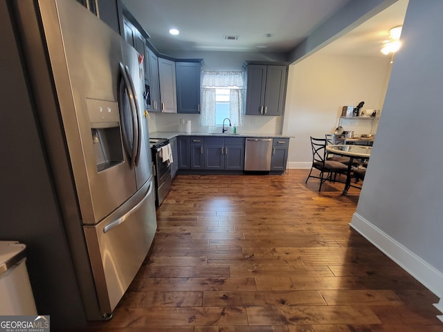 475 Willard Ave SW, Atlanta, GA 30310 - kitchen featuring light countertops, visible vents, a sink, appliances with stainless steel finishes, and dark wood-style flooring