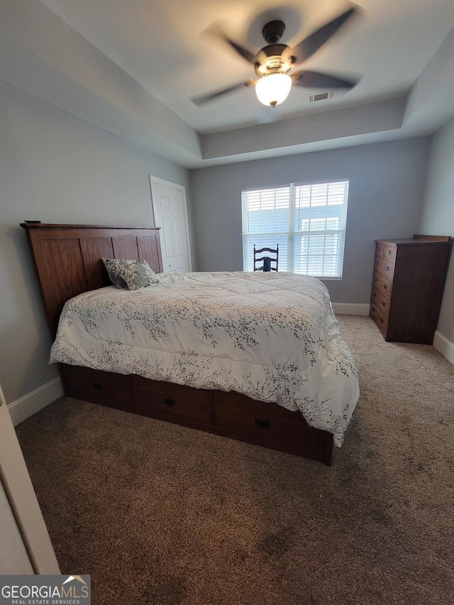475 Willard Ave SW, Atlanta, GA 30310 - bedroom with a tray ceiling, visible vents, baseboards, light colored carpet, and ceiling fan