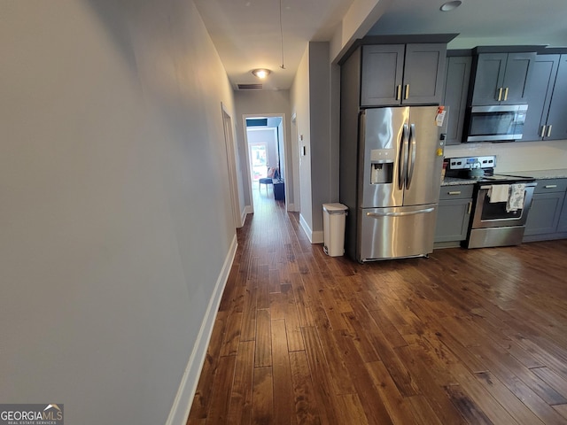 475 Willard Ave SW, Atlanta, GA 30310 - kitchen featuring visible vents, baseboards, dark wood-type flooring, and appliances with stainless steel finishes