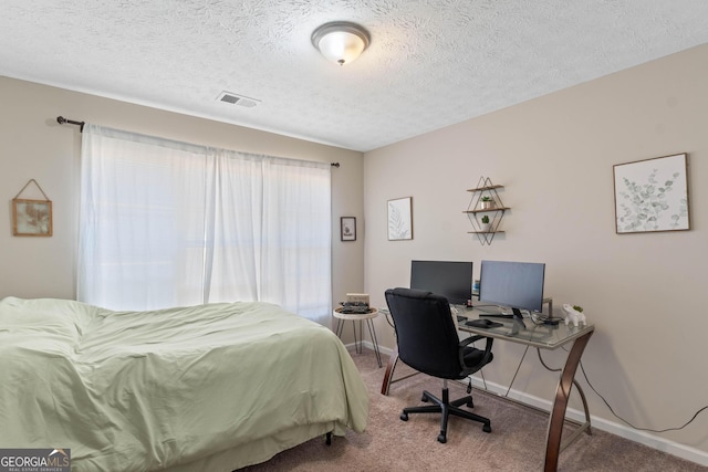 1012 Miss Amber Way, Locust Grove, GA 30248 - bedroom featuring carpet flooring, baseboards, a textured ceiling, and a desk
