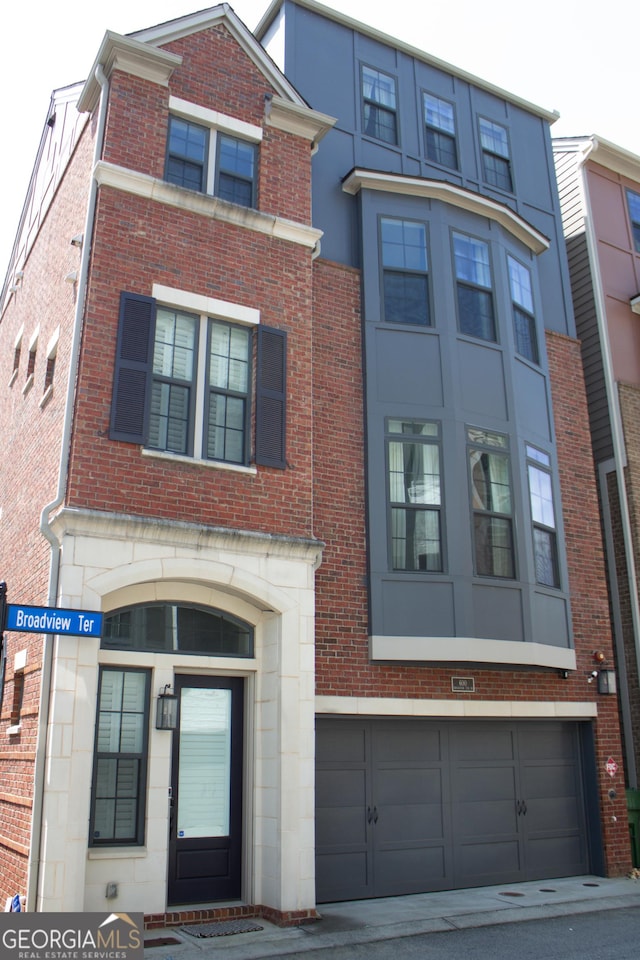 600 Broadview Ter NE, Atlanta, GA 30324 - view of front of property featuring brick siding and a garage