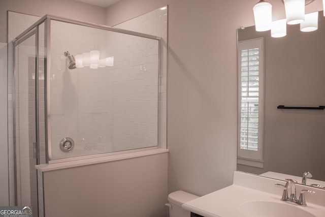600 Broadview Ter NE, Atlanta, GA 30324 - bathroom featuring a shower stall, a healthy amount of sunlight, and vanity