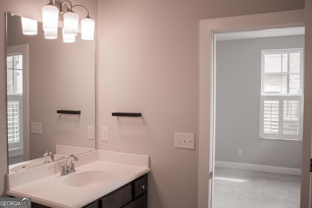 600 Broadview Ter NE, Atlanta, GA 30324 - bathroom featuring vanity, baseboards, and an inviting chandelier
