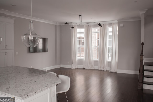 600 Broadview Ter NE, Atlanta, GA 30324 - unfurnished dining area featuring baseboards, dark wood-type flooring, and ornamental molding