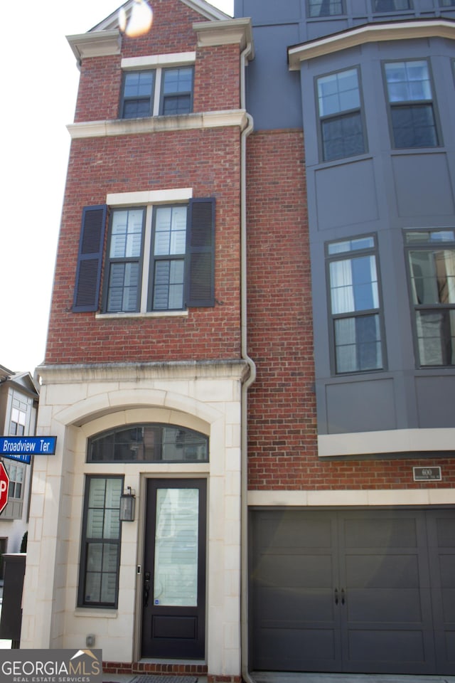 600 Broadview Ter NE, Atlanta, GA 30324 - view of front of property featuring brick siding and a garage