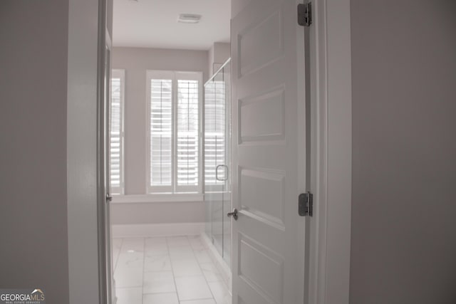 600 Broadview Ter NE, Atlanta, GA 30324 - full bathroom with baseboards, marble finish floor, and a stall shower