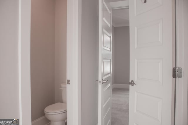 600 Broadview Ter NE, Atlanta, GA 30324 - bathroom featuring baseboards and toilet