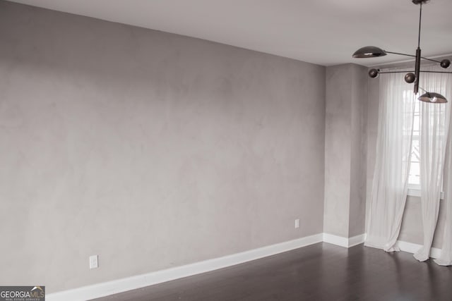 600 Broadview Ter NE, Atlanta, GA 30324 - empty room with dark wood finished floors and baseboards
