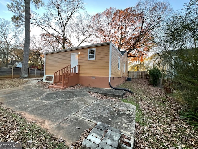 rear view of house with a patio and fence