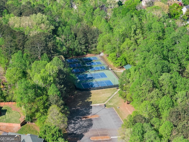 drone / aerial view featuring a forest view