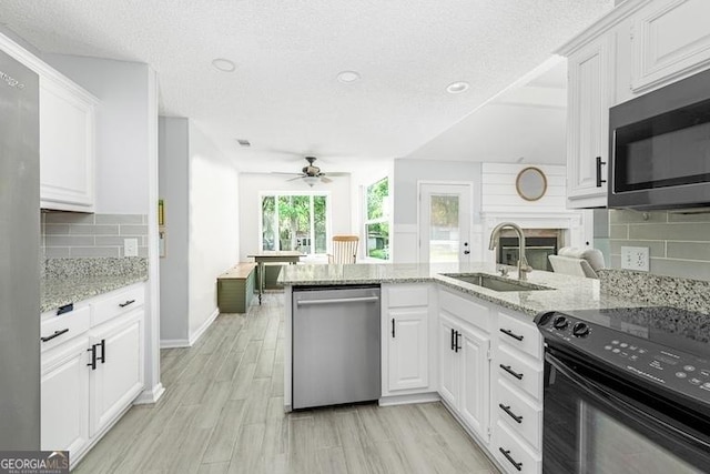 1163 Bristol Hammock Cir, Kingsland, GA 31548 - kitchen featuring stainless steel appliances, a ceiling fan, decorative backsplash, white cabinetry, and recessed lighting