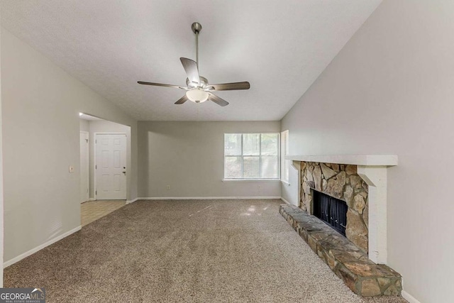 5307 Jay Way NW, Lilburn, GA 30047 - unfurnished living room with ceiling fan, a fireplace, baseboards, lofted ceiling, and carpet flooring