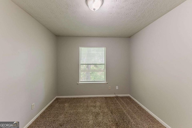 5307 Jay Way NW, Lilburn, GA 30047 - carpeted empty room featuring baseboards and a textured ceiling
