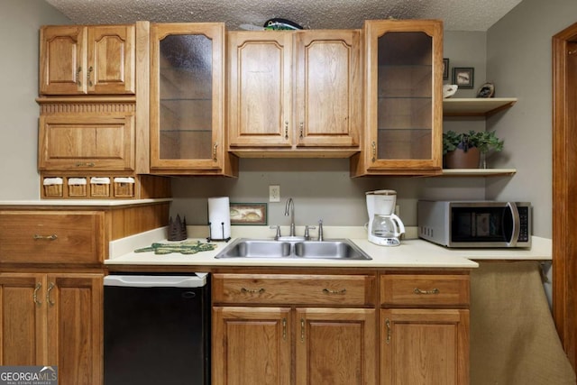 736 Cedar Ridge Rd, Hartwell, GA 30643 - kitchen featuring stainless steel microwave, light countertops, a textured ceiling, and a sink