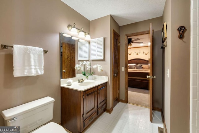 736 Cedar Ridge Rd, Hartwell, GA 30643 - bathroom with a textured ceiling, connected bathroom, vanity, toilet, and visible vents
