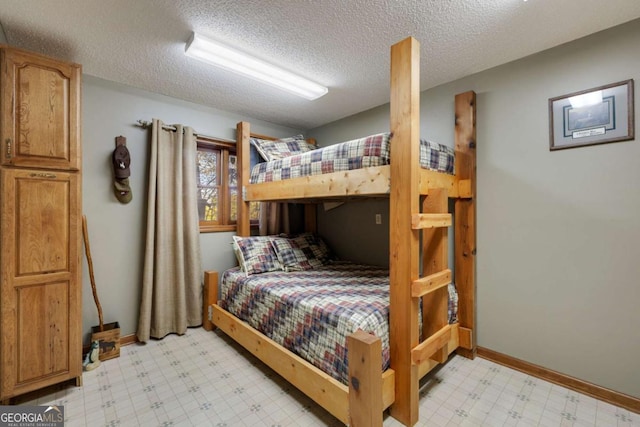 736 Cedar Ridge Rd, Hartwell, GA 30643 - bedroom with a textured ceiling, baseboards, and light floors