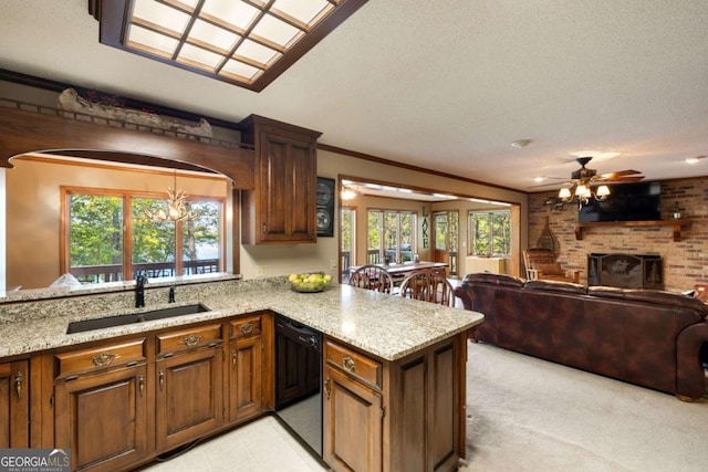 736 Cedar Ridge Rd, Hartwell, GA 30643 - kitchen with light stone countertops, open floor plan, a sink, and black dishwasher