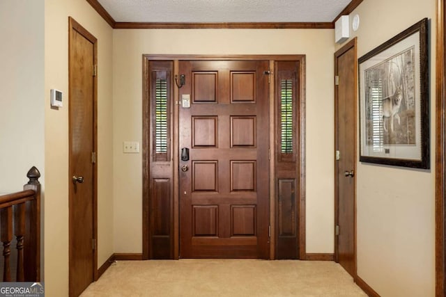 736 Cedar Ridge Rd, Hartwell, GA 30643 - foyer entrance featuring carpet floors, ornamental molding, a textured ceiling, and baseboards