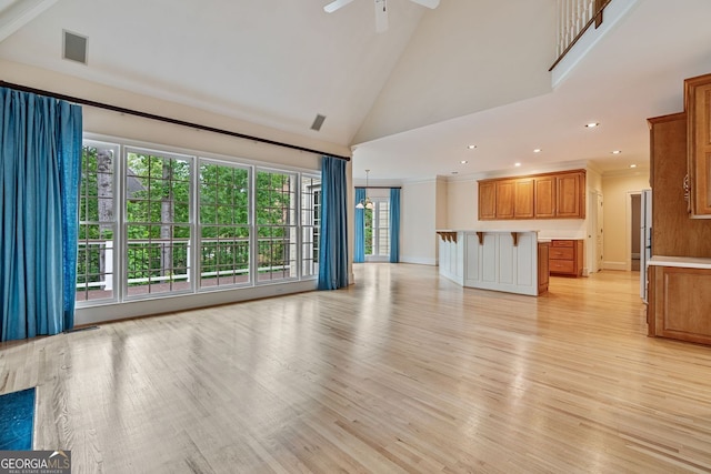 3105 Birchton St, Johns Creek, GA 30022 - unfurnished living room with light wood-style floors, high vaulted ceiling, ceiling fan, recessed lighting, and baseboards