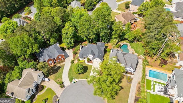 aerial perspective of suburban area with a pool