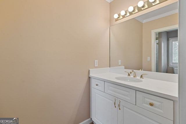 bathroom featuring crown molding and vanity